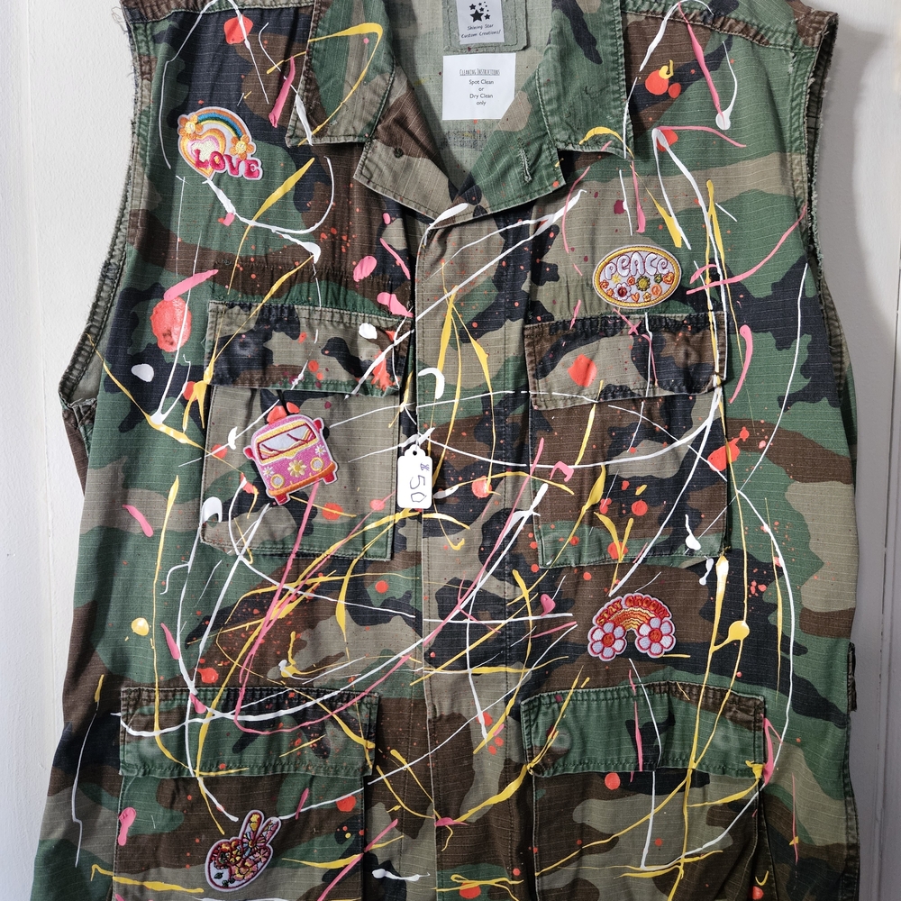 Camouflage Vest with Colorful Patches and Paint Splatter